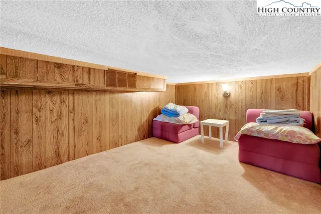 a bedroom with a bed and a shower