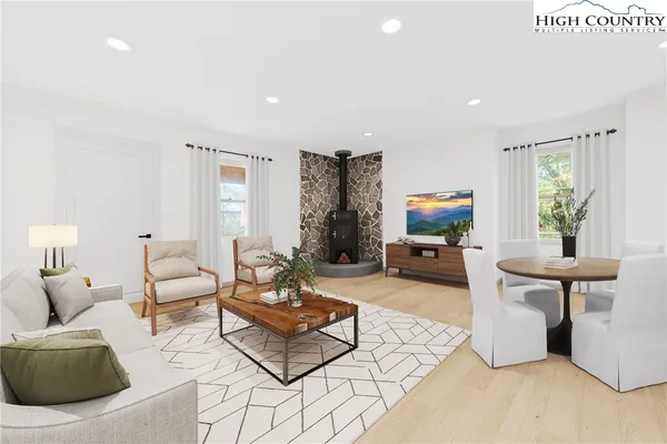 a living room with furniture and a table