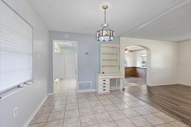 a view of a door with wooden floor and a window