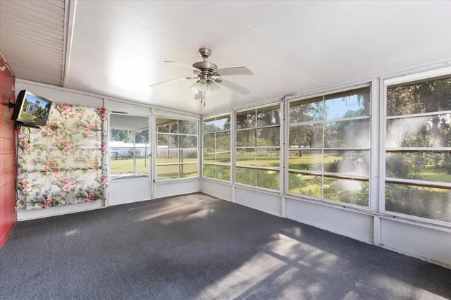 front view of a house with a tree