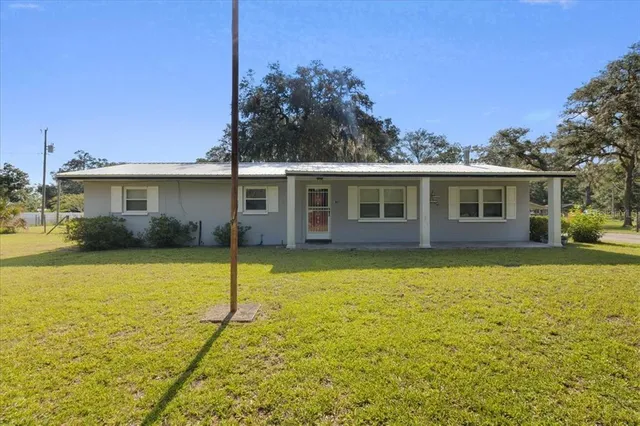 a view of a house with swimming pool