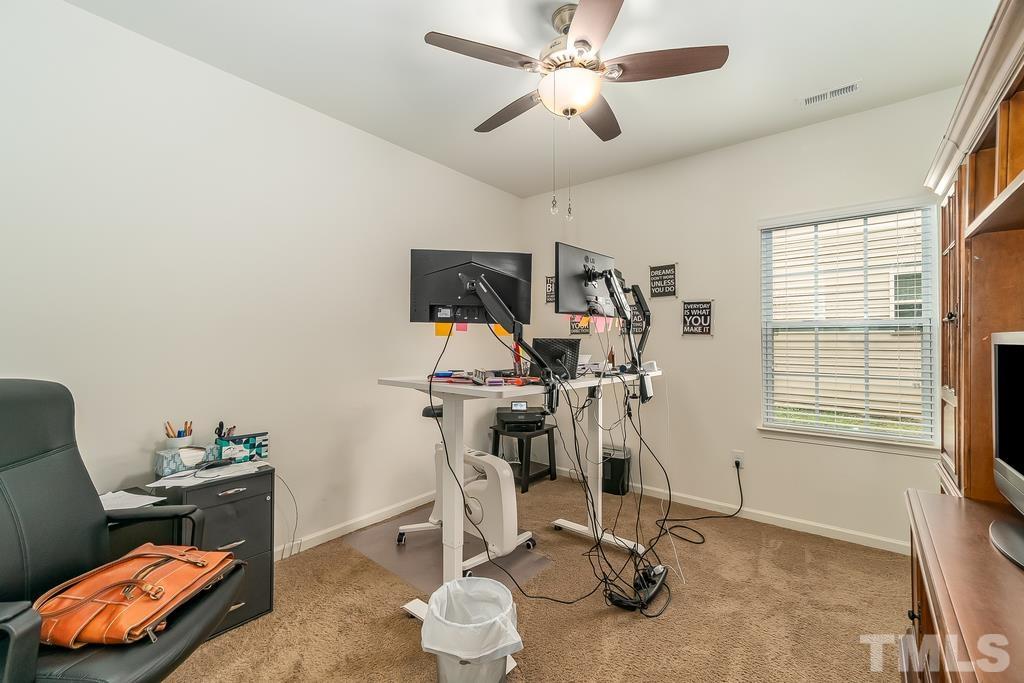 1505 Stark Spring Street Raleigh, NC 27610 - Photo 16 of 22 a view of a room with gym equipment