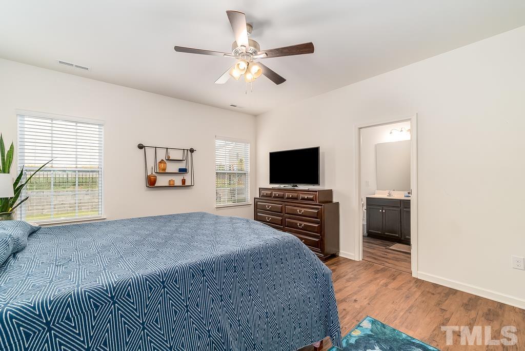 1505 Stark Spring Street Raleigh, NC 27610 - Photo 18 of 22 a living room with furniture and a flat screen tv