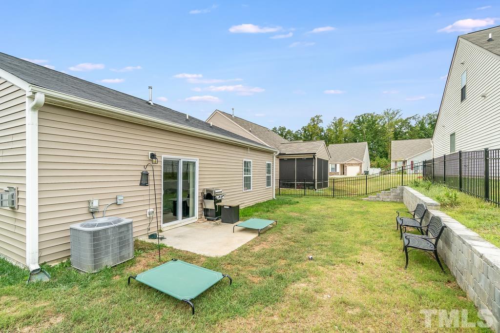 1505 Stark Spring Street Raleigh, NC 27610 - Photo 20 of 22 a view of a house with backyard and sitting area