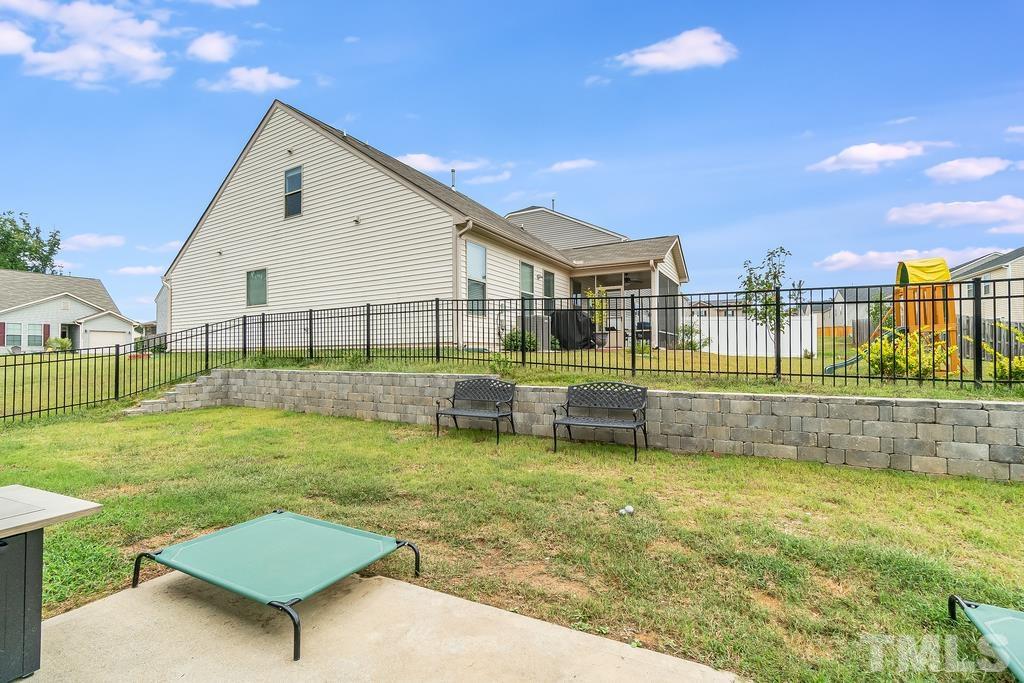 1505 Stark Spring Street Raleigh, NC 27610 - Photo 21 of 22 a view of a backyard with a garden and plants