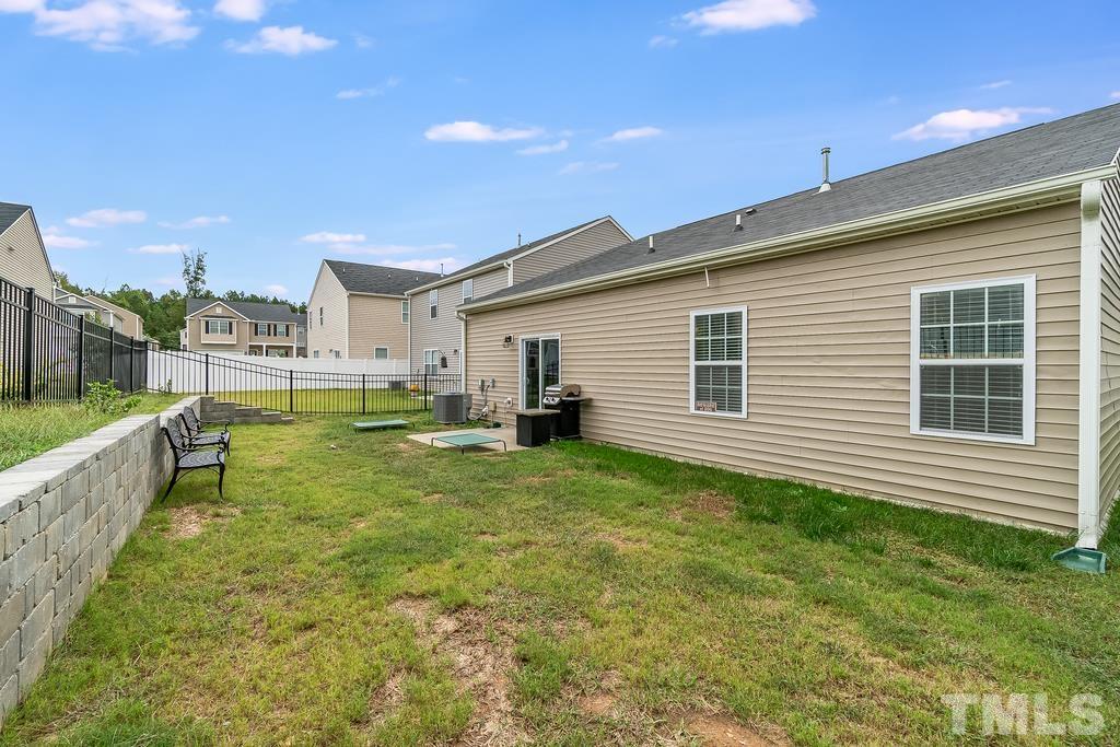 1505 Stark Spring Street Raleigh, NC 27610 - Photo 22 of 22 a view of a house with a backyard