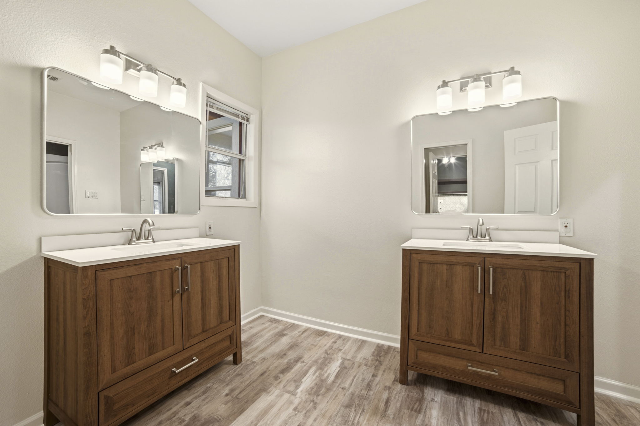 20001 Hamilton Pool Road Dripping Springs, TX 78620 - Photo 26 of 40 Recently updated with new flooring, vanities, mirrors, and light fixtures.