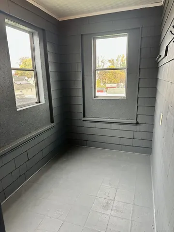 a view of an empty room with a window