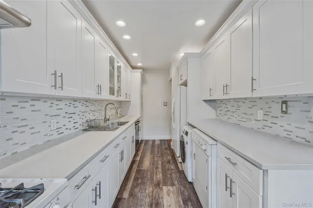 a large kitchen with cabinets