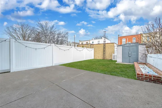 a view of a house with a yard and garage