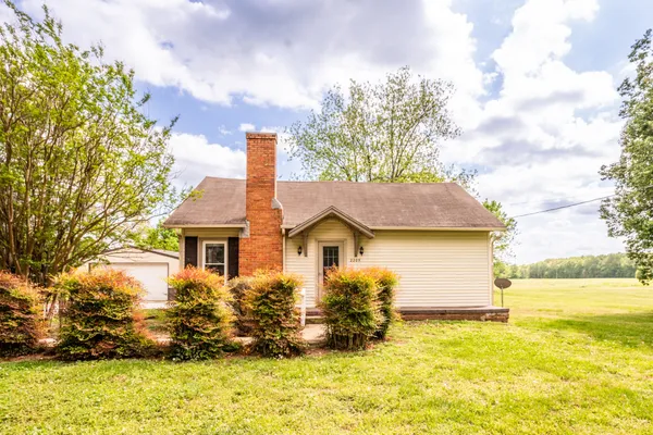 a kitchen with stainless steel appliances granite countertop a stove a sink dishwasher and a refrigerator