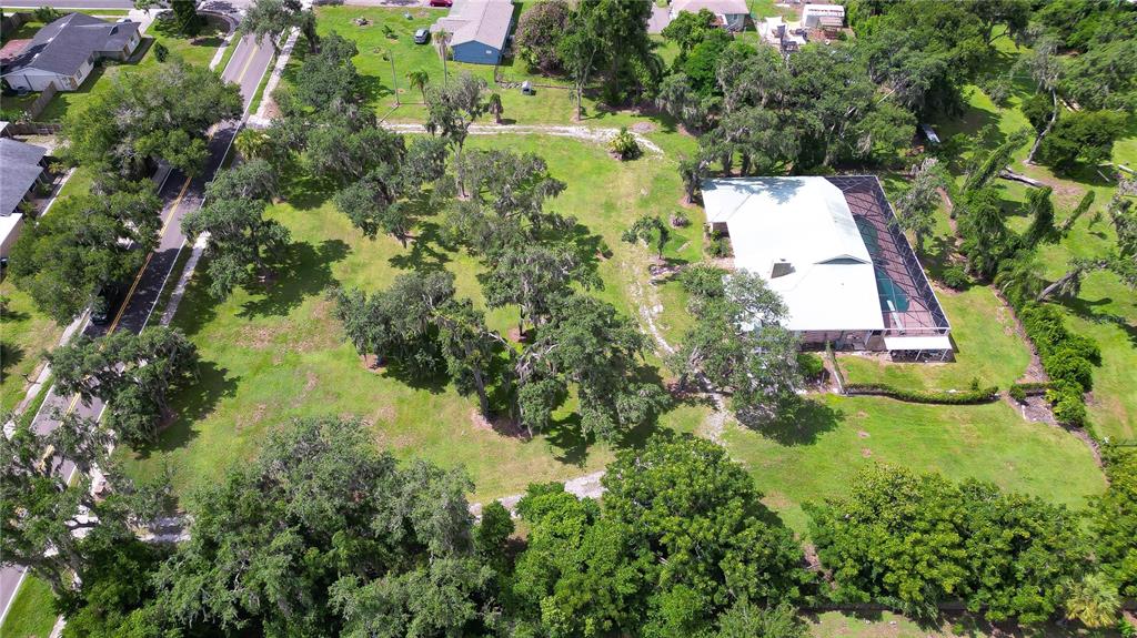 914 South Miller Road Valrico, FL 33594 - Photo 3 of 51 an aerial view of residential house with pool and trees