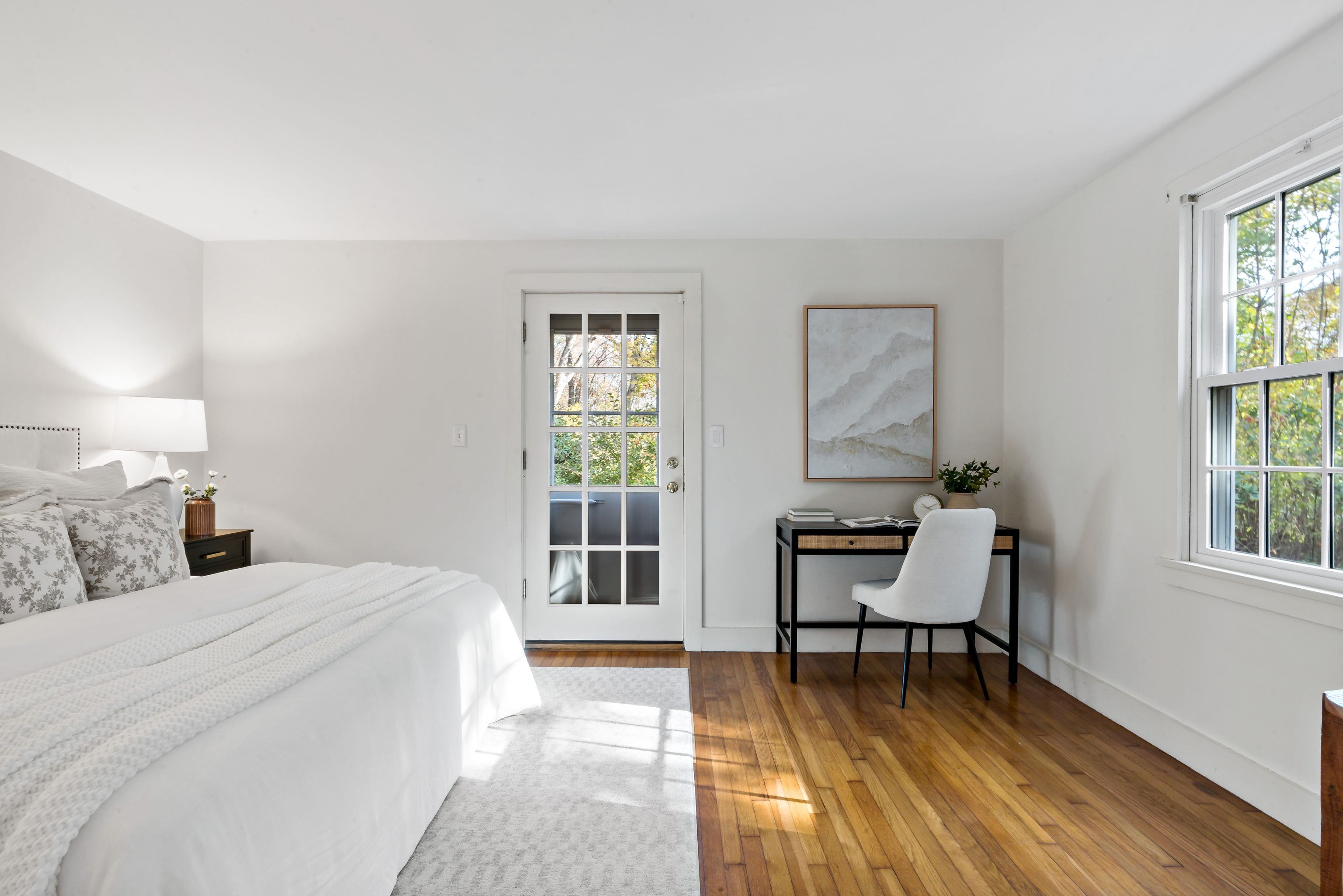 12 Flanders Road Stonington, CT 06378 - Photo 14 of 36 a bedroom with a bed and a window