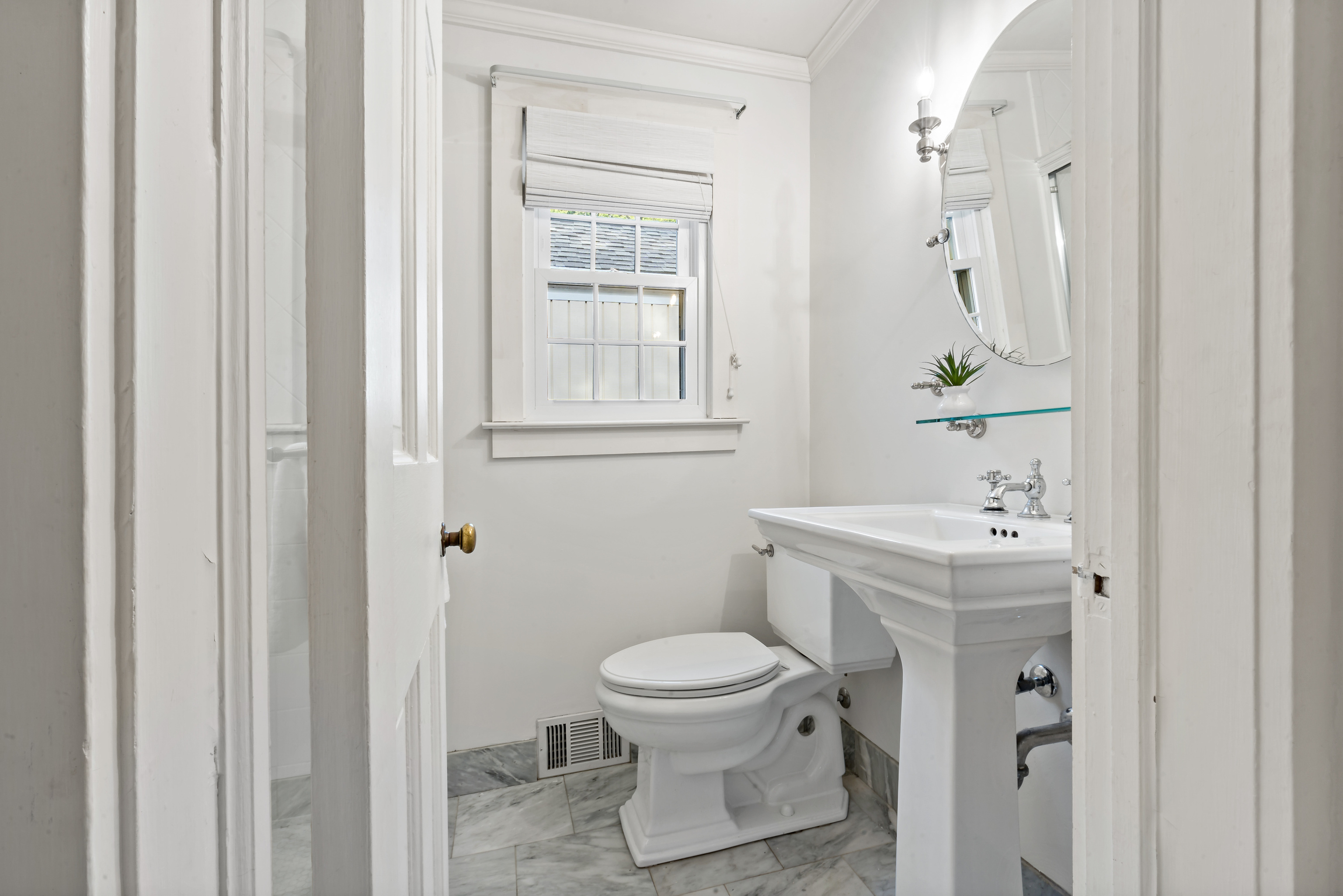 12 Flanders Road Stonington, CT 06378 - Photo 17 of 36 a bathroom with a toilet a sink and a mirror