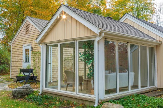 a view of a glass door and an outdoor space