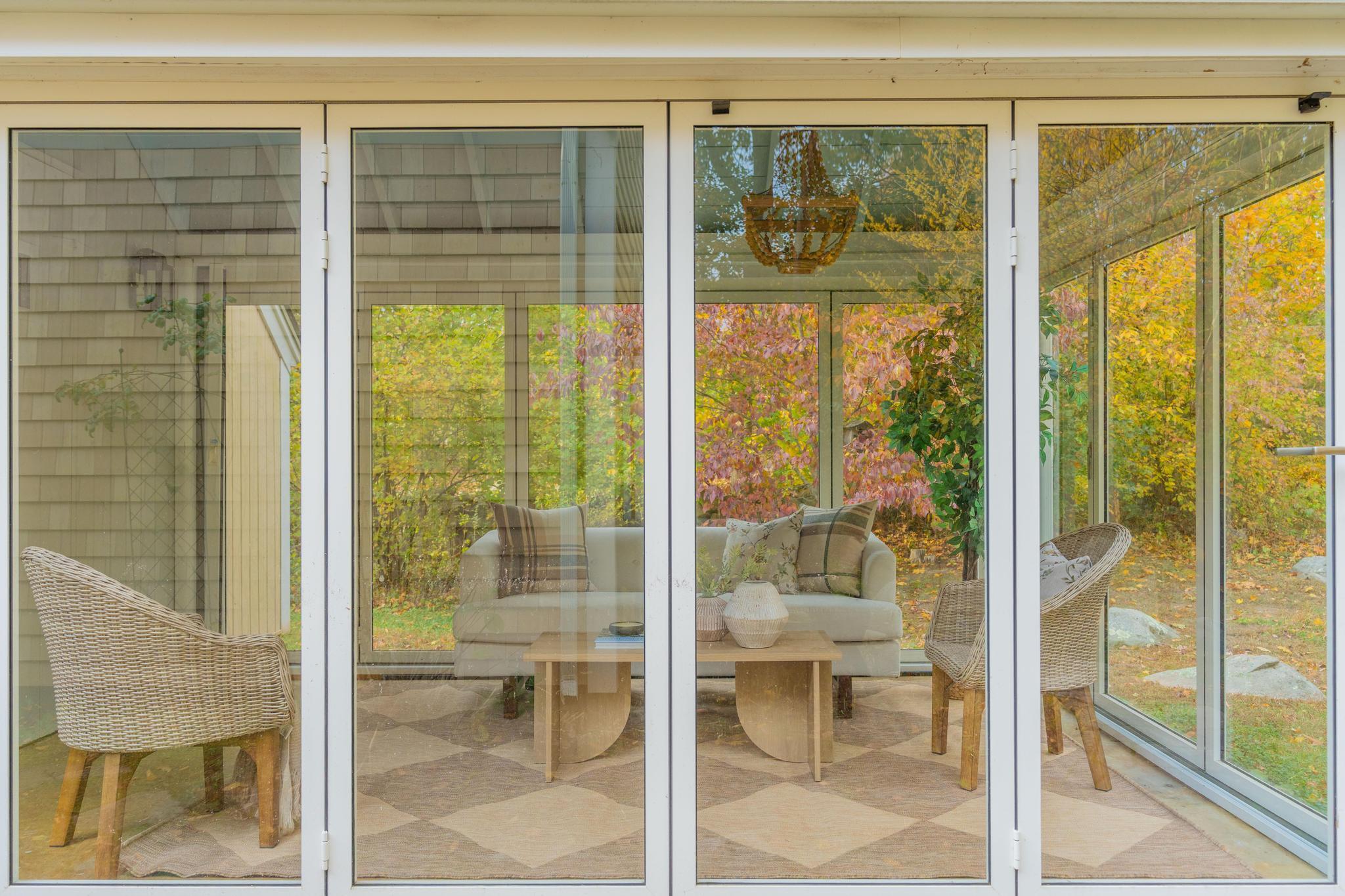 12 Flanders Road Stonington, CT 06378 - Photo 26 of 36 a view of a glass door and an outdoor space
