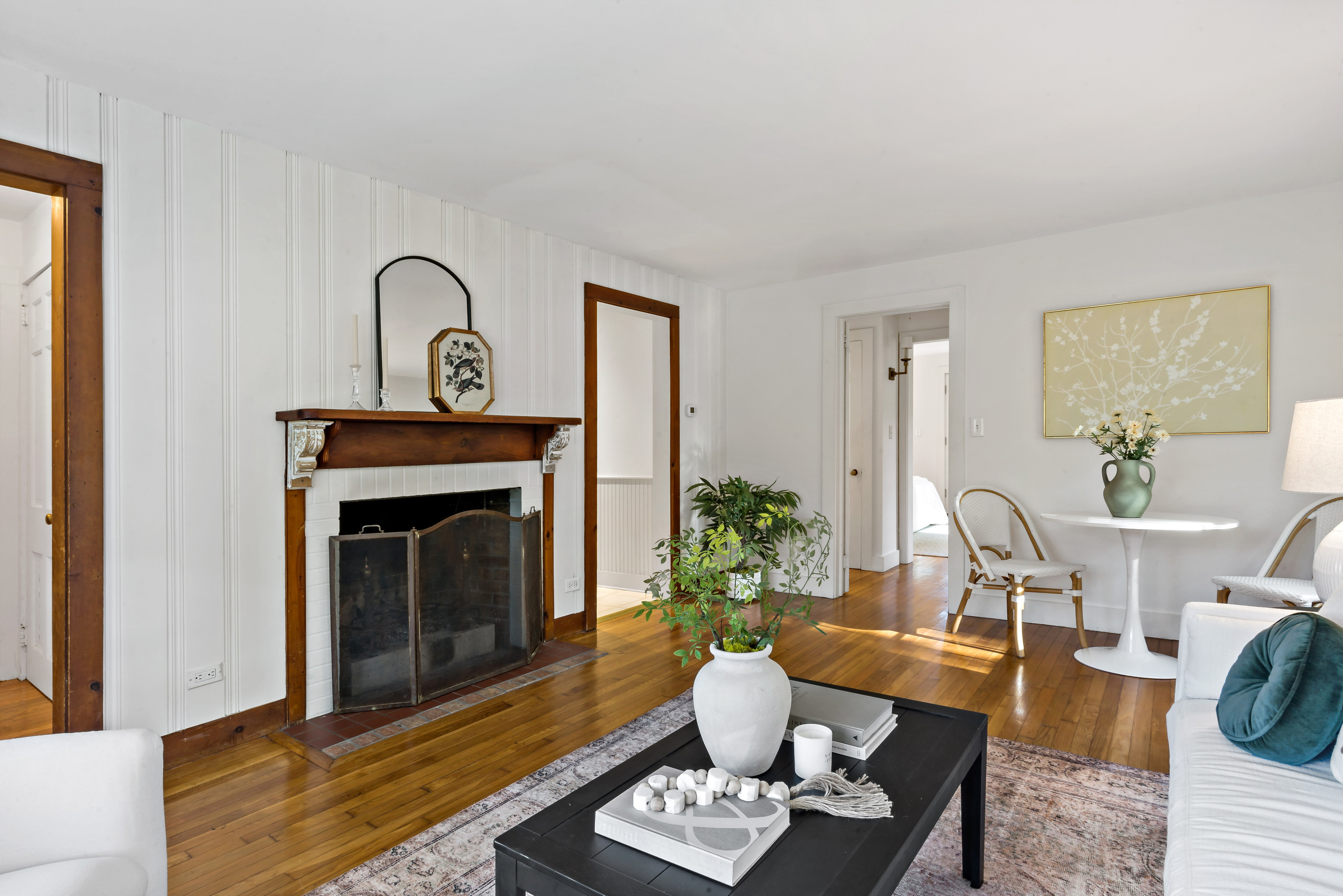 12 Flanders Road Stonington, CT 06378 - Photo 7 of 36 a living room with furniture a potted plant and a fireplace