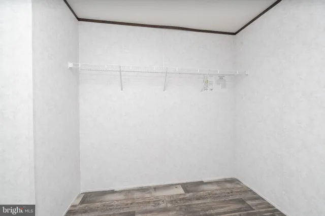 a view of a room with racks on the wall