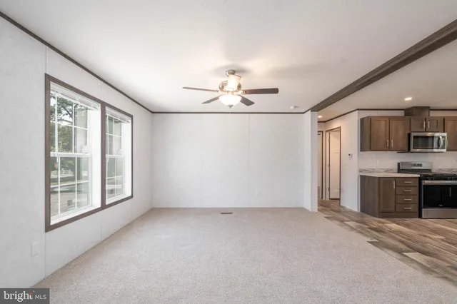 a view of a kitchen with a sink and a window