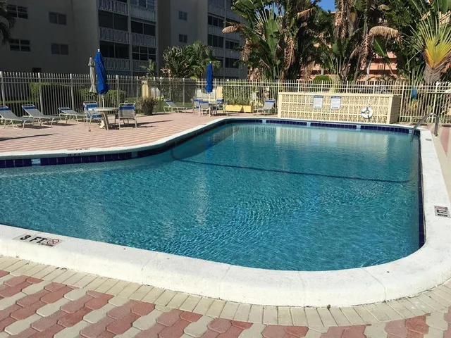 a view of swimming pool and outdoor seating