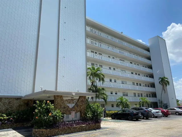 a view of building with parking space