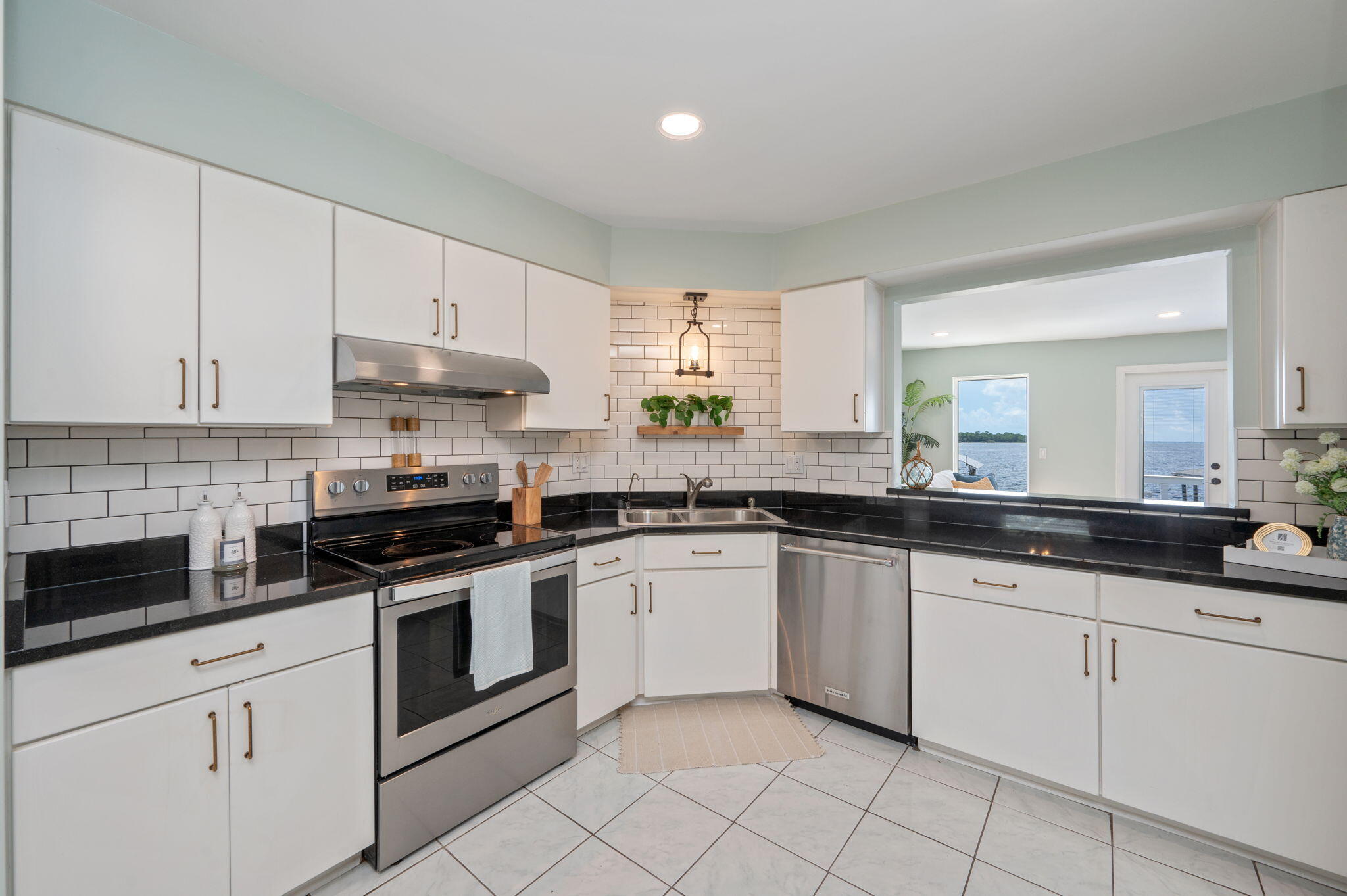 3 Bayshore Point Valparaiso, FL 32580 - Photo 19 of 70 a kitchen with granite countertop white cabinets white stainless steel appliances with a sink and dishwasher