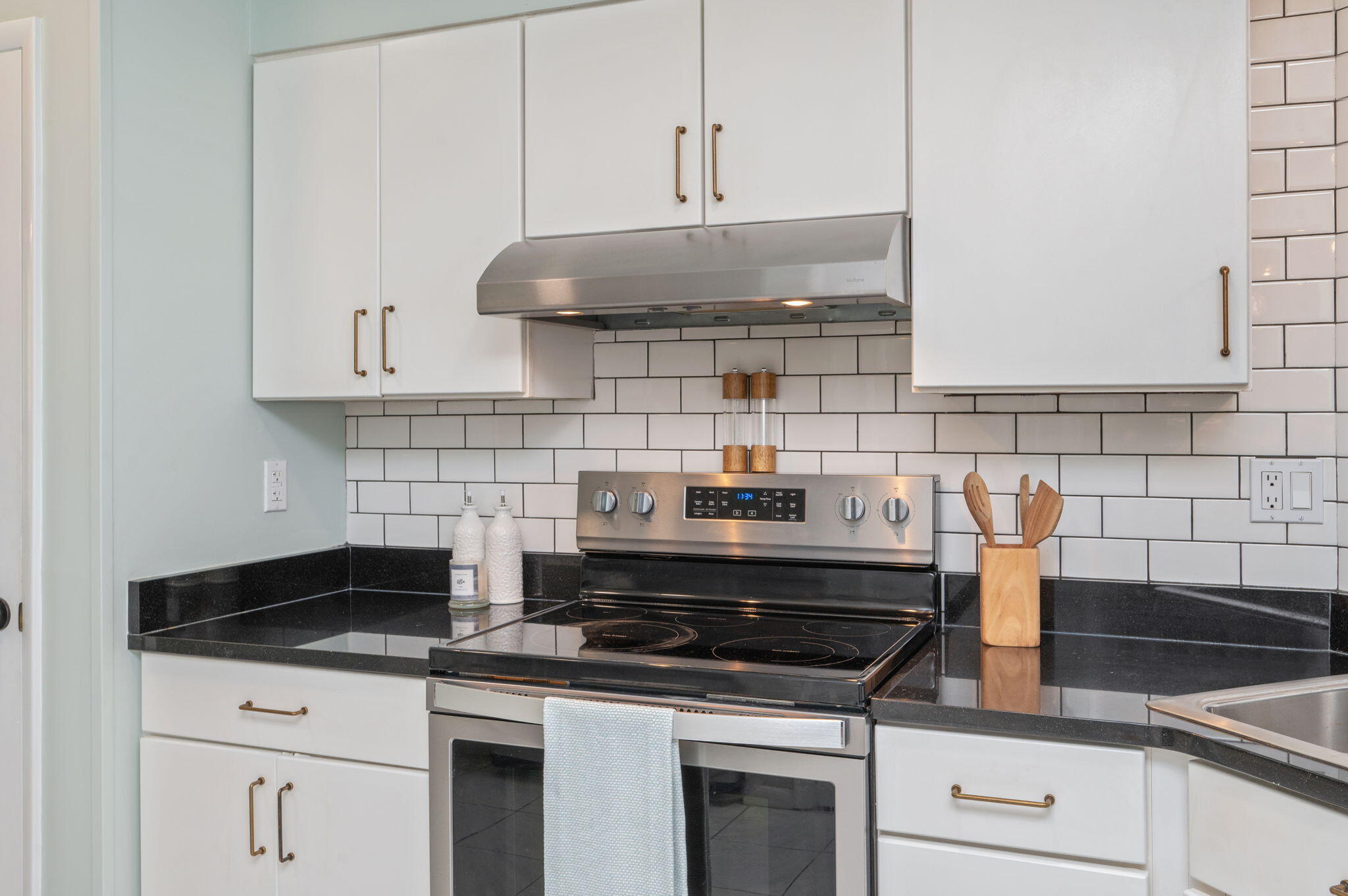 3 Bayshore Point Valparaiso, FL 32580 - Photo 21 of 70 a kitchen with stainless steel appliances granite countertop white cabinets and a stove a oven with white countertops