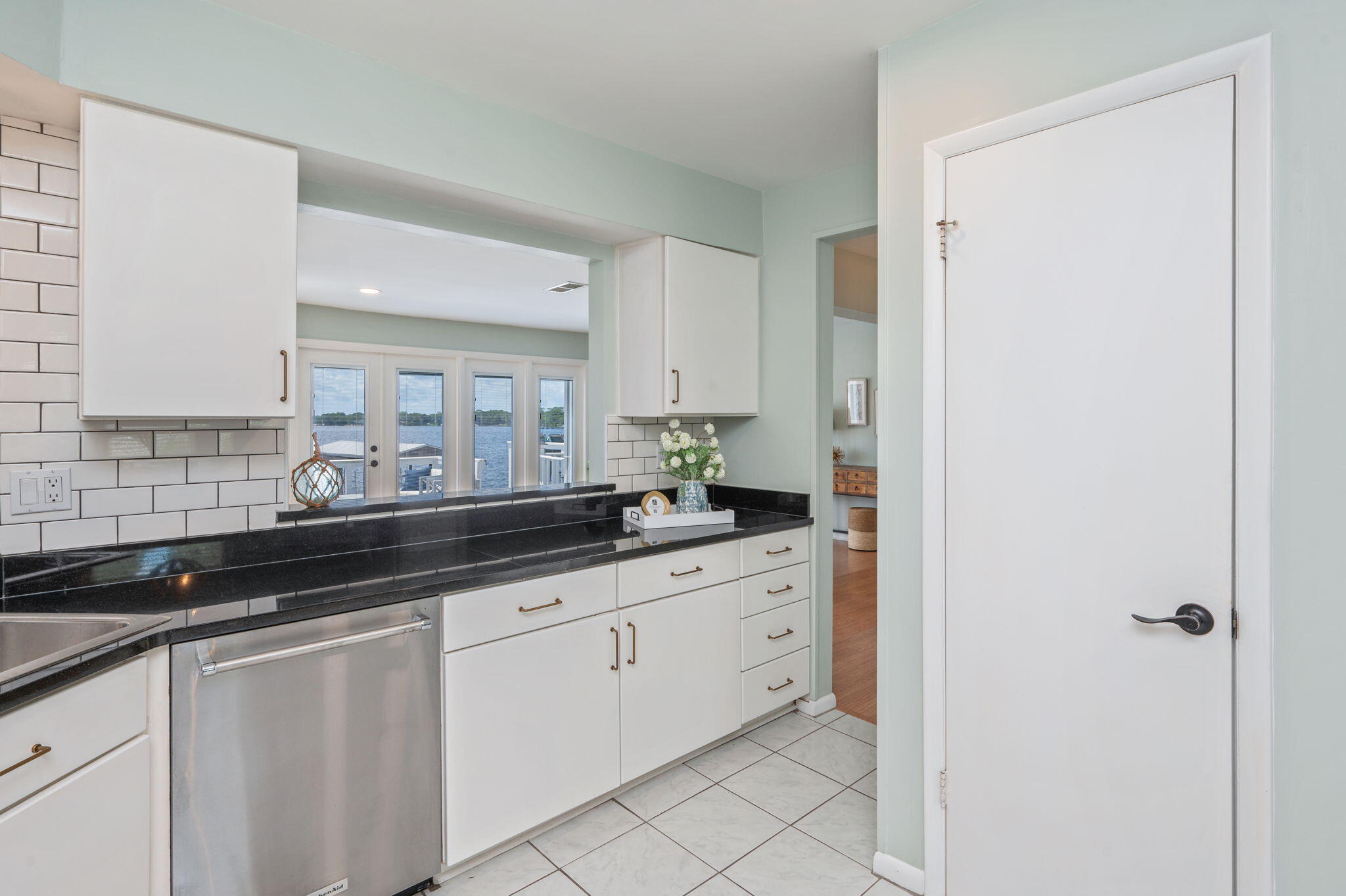 3 Bayshore Point Valparaiso, FL 32580 - Photo 22 of 70 a kitchen with granite countertop white cabinets and a sink