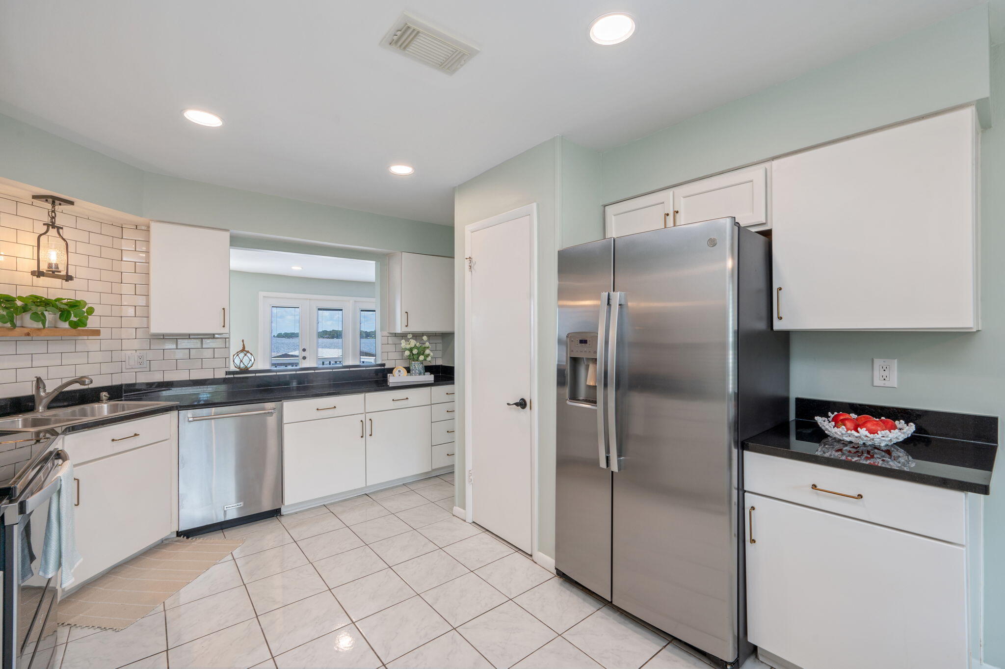 3 Bayshore Point Valparaiso, FL 32580 - Photo 23 of 70 a kitchen with stainless steel appliances granite countertop a refrigerator and a sink