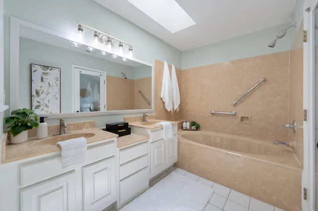 a bathroom with a shower curtain and a window