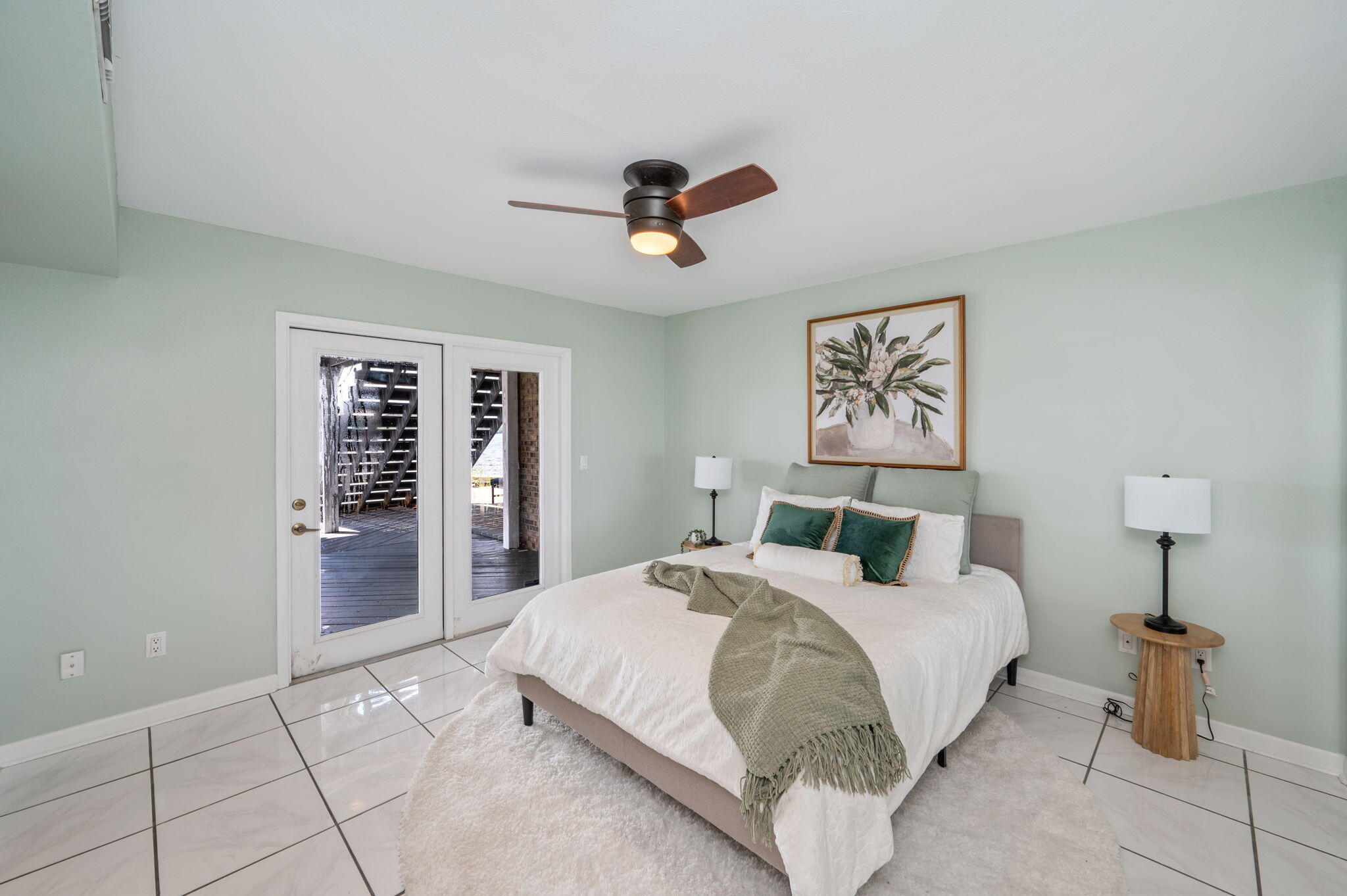 3 Bayshore Point Valparaiso, FL 32580 - Photo 32 of 70 a bedroom with a large bed and a chandelier