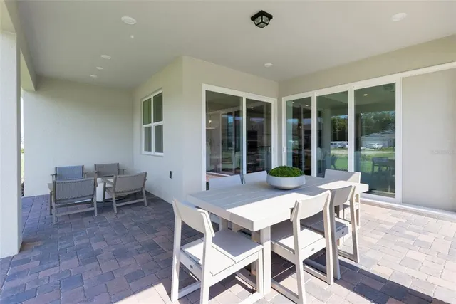 a view of a dining room with furniture window and outside view