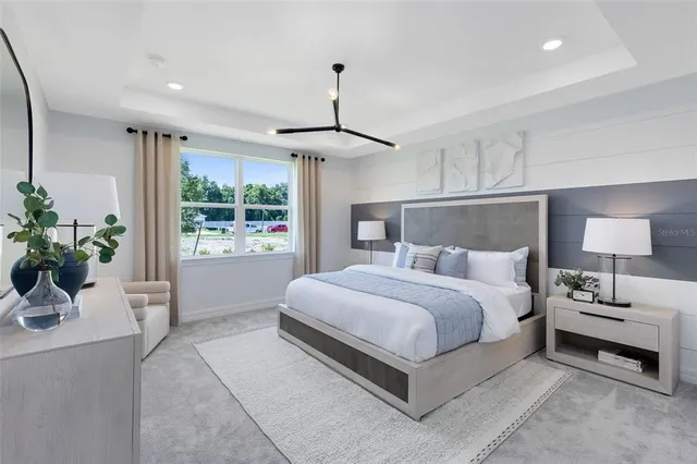 a bed room with a bed and a window