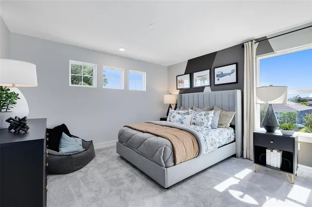 a bedroom with a bed and a couch