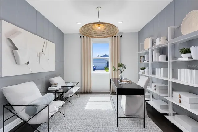 a dining room with furniture and window