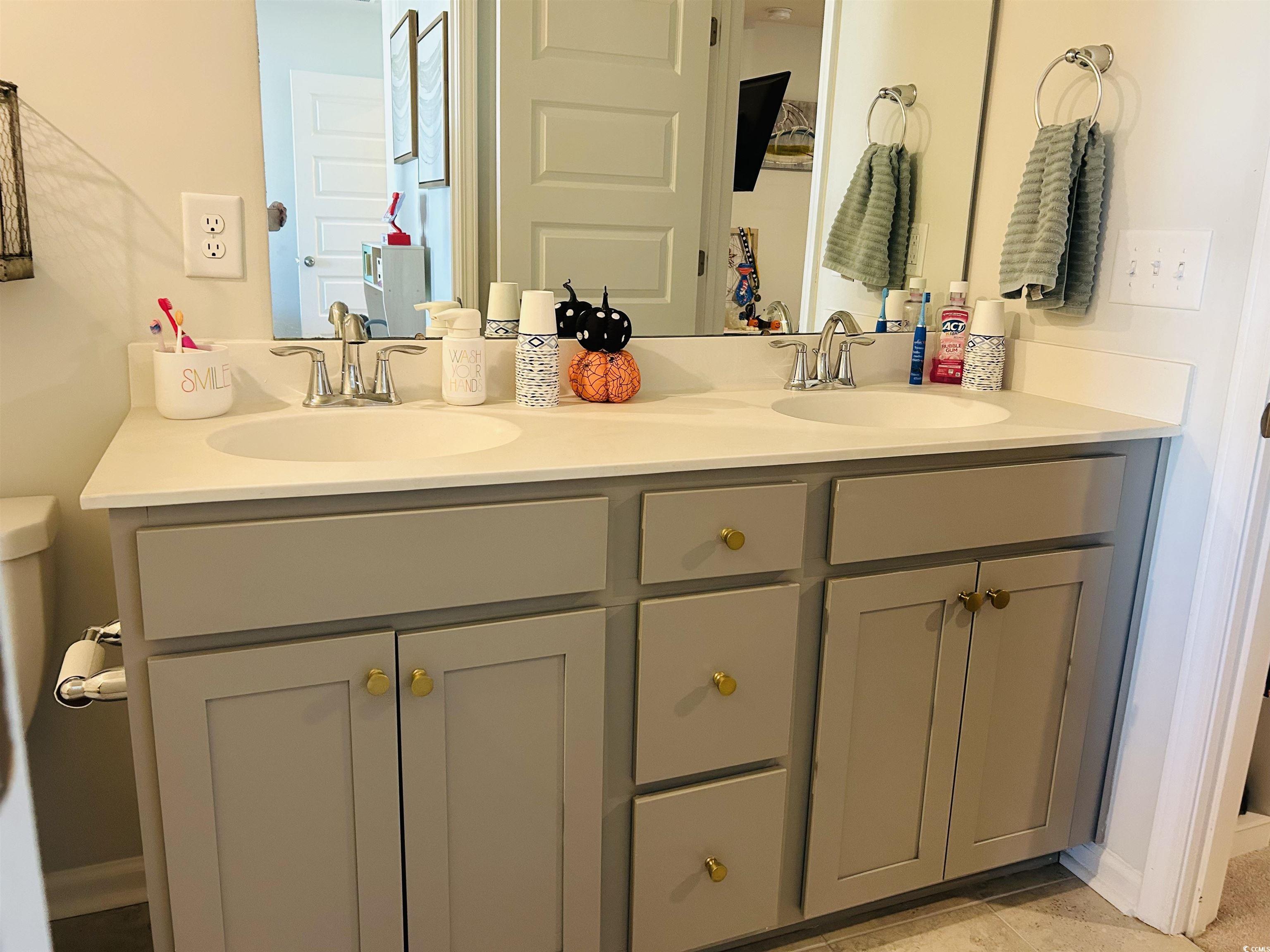 609 Shortleaf Path Myrtle Beach, SC 29577 - Photo 13 of 40 Full bathroom with double vanity and light tile patterned floors