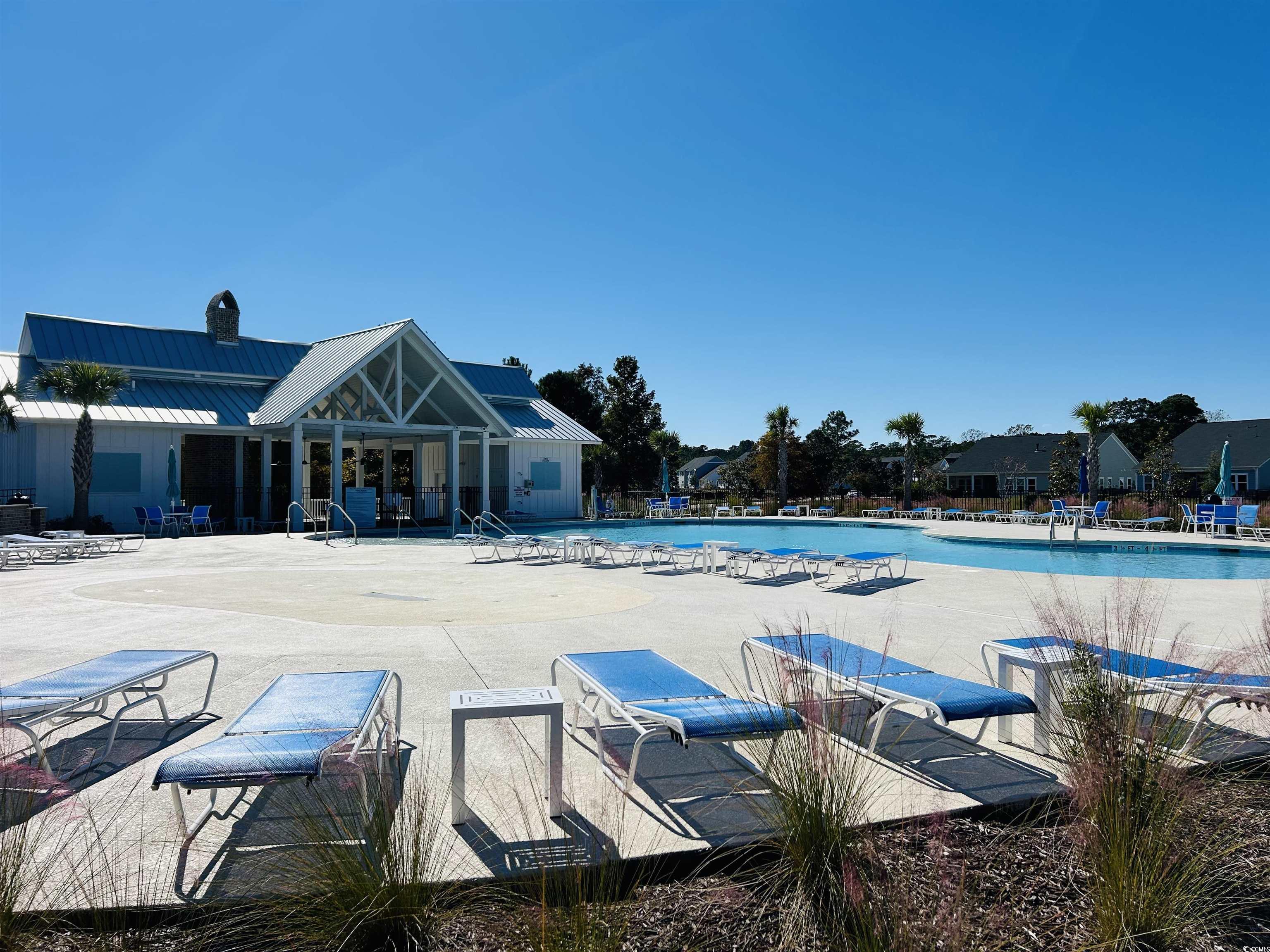609 Shortleaf Path Myrtle Beach, SC 29577 - Photo 23 of 40 Community pool featuring a patio