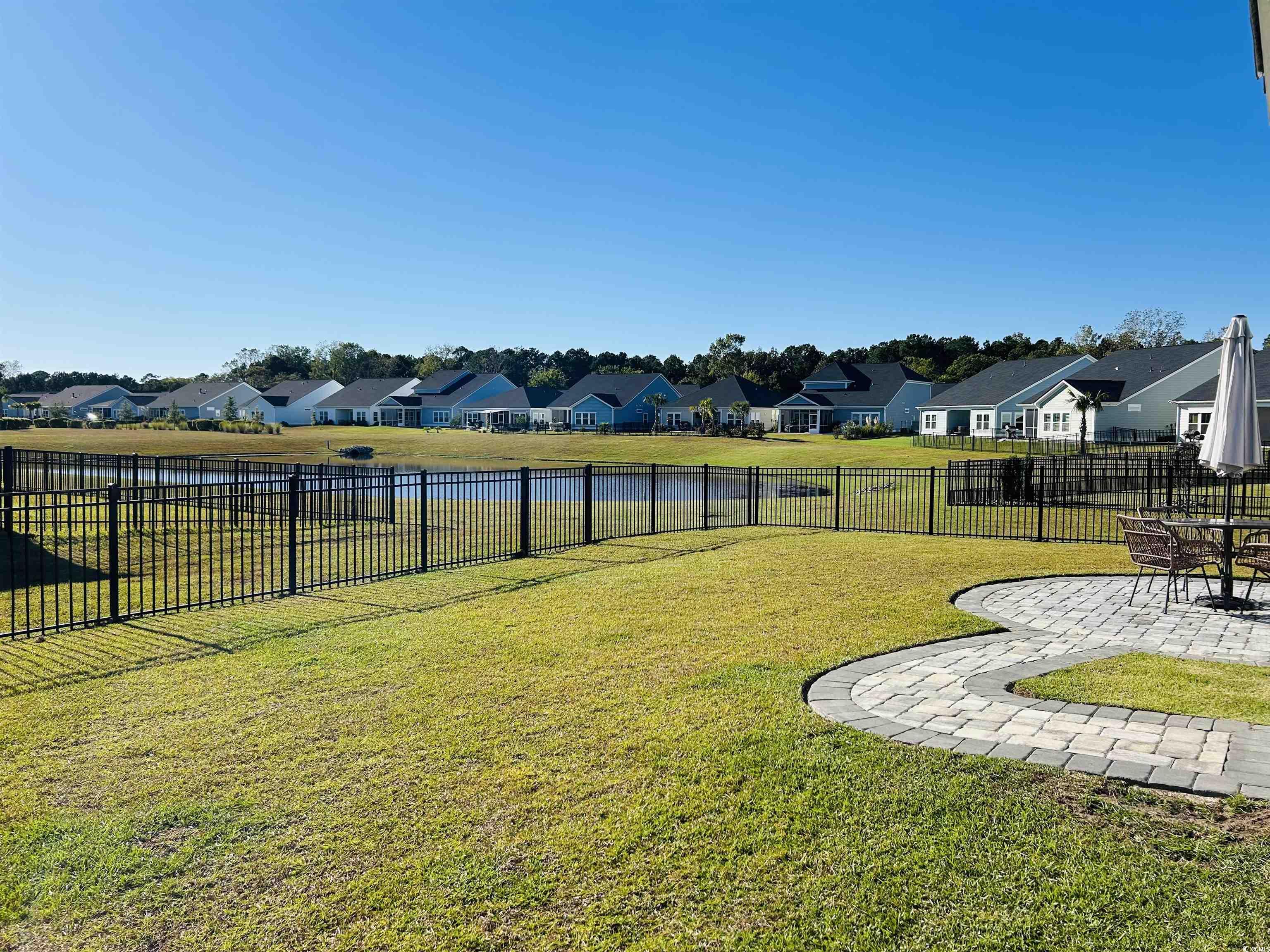 609 Shortleaf Path Myrtle Beach, SC 29577 - Photo 27 of 40 Fenced backyard featuring a residential view, a water view, and a patio