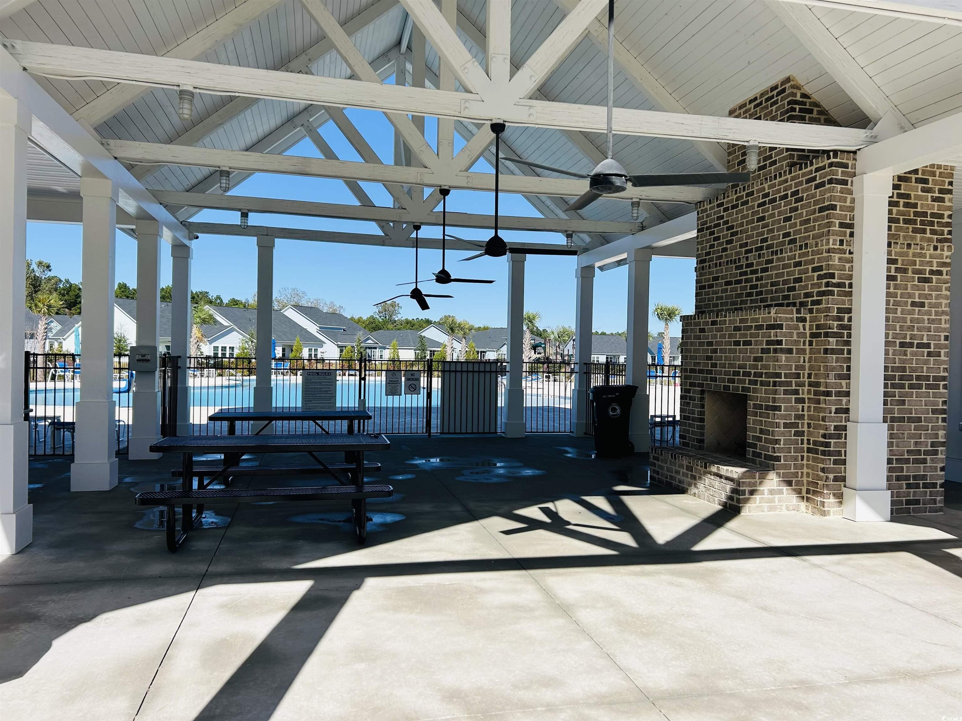 609 Shortleaf Path Myrtle Beach, SC 29577 - Photo 35 of 40 View of patio, ceiling fan, and a swimming pool
