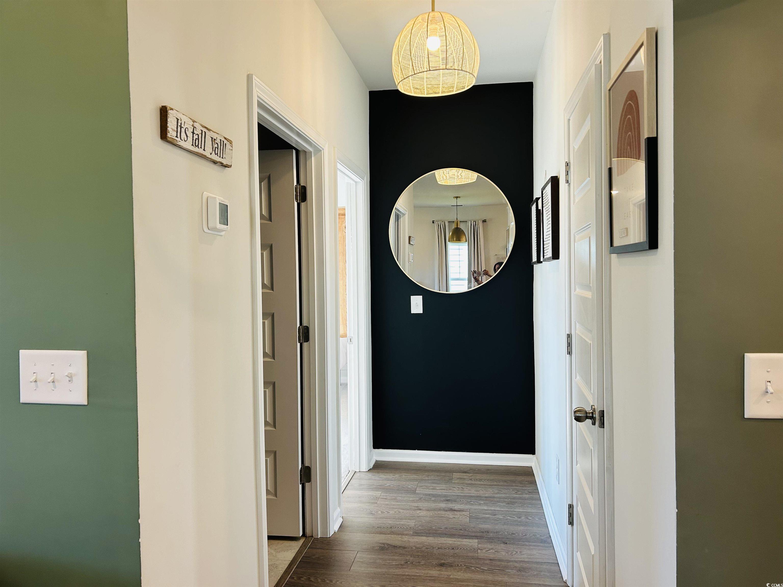 609 Shortleaf Path Myrtle Beach, SC 29577 - Photo 9 of 40 Hall with wood finished floors and baseboards