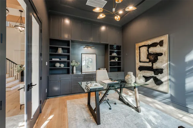 a view of a dining room with furniture and chandelier