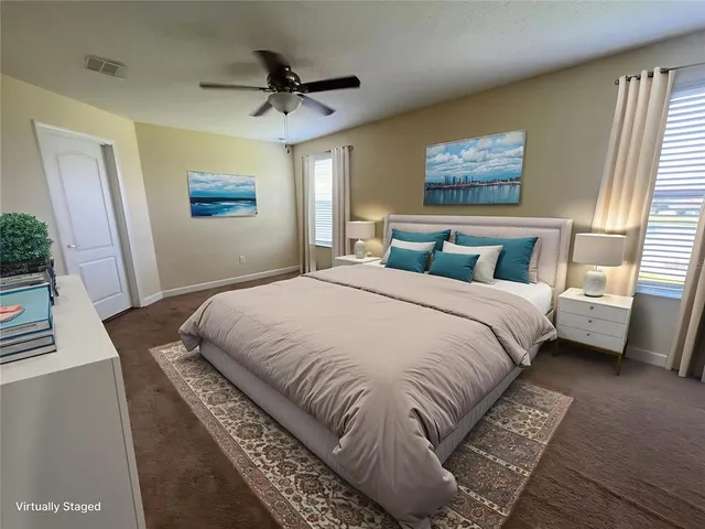 a bedroom with double bed and a window