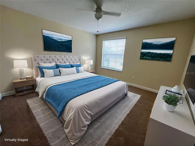 a bedroom with bed and a window