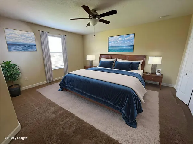 a bedroom with a bed chandelier and a window