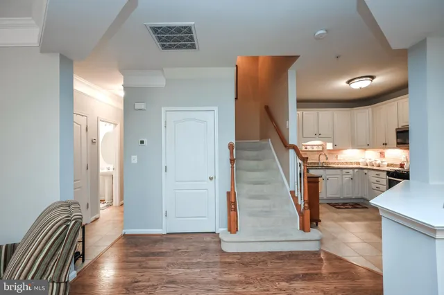 a view of entryway and kitchen