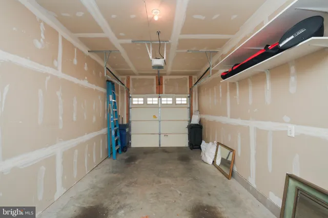 a bedroom with a bed lamps and dresser