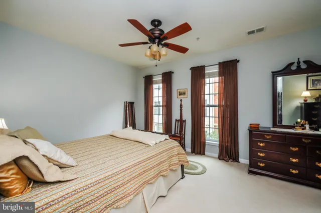 a bed room with a bed and dresser