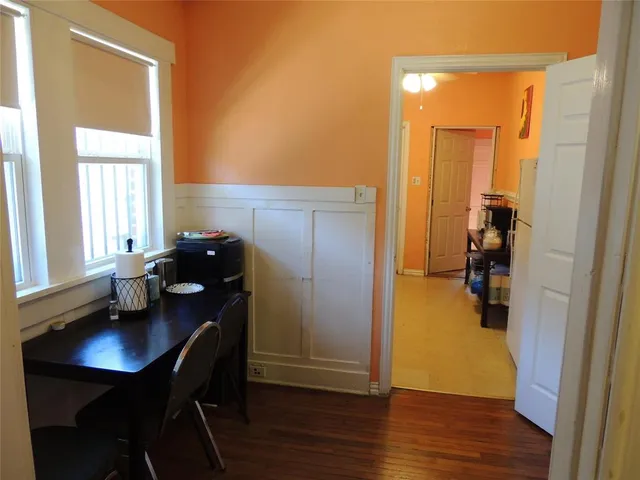 a workspace with furniture and wooden floor