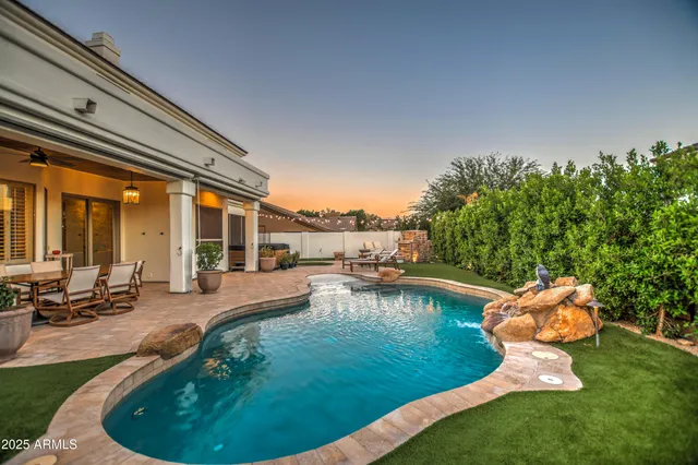 a patio with a table and chairs