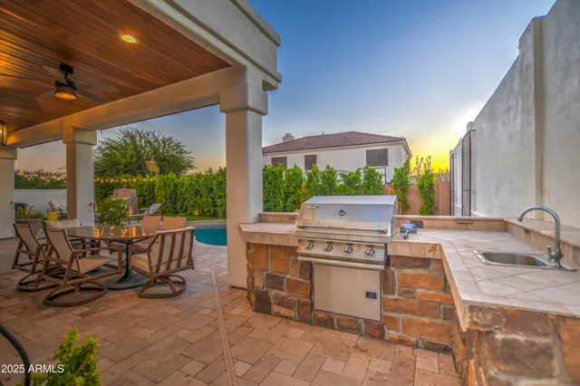 a view of a chairs and table in a patio